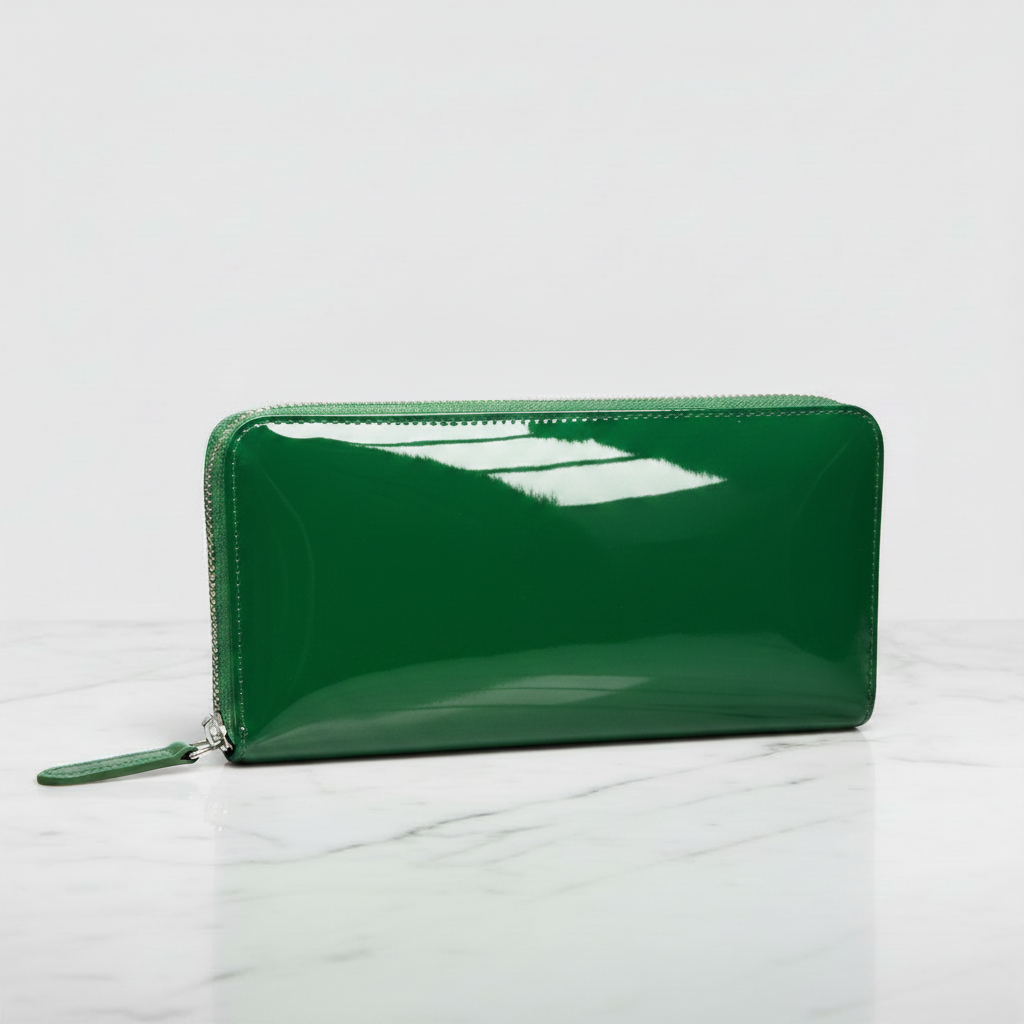 THE Unknown Wallet patent leather ultra glossy emerald green zip-around wallet on marble surface
