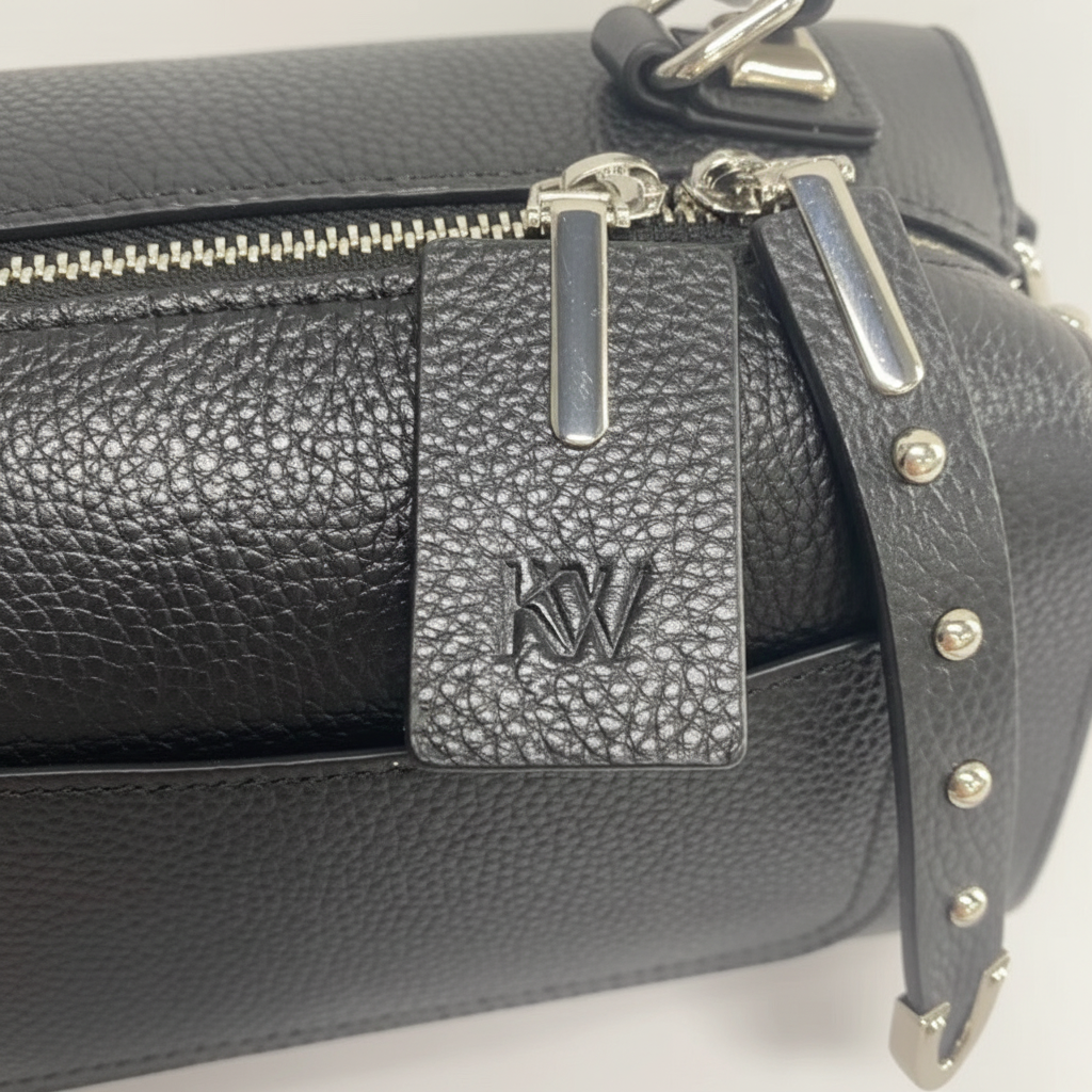 THE LUXE Bag KW embossed hardware close-up detail
